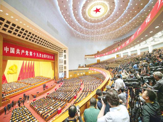 Xi joins Mao in Communist constitution, tightening grip on China