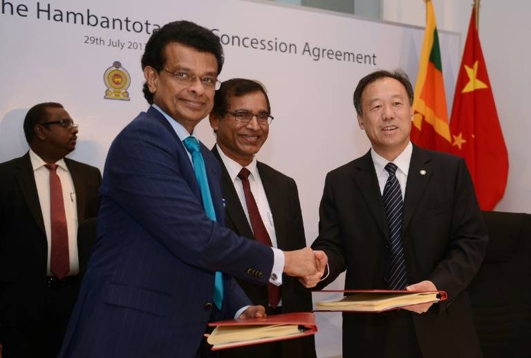 Sri Lanka hands over debt-laden port to Chinese owner