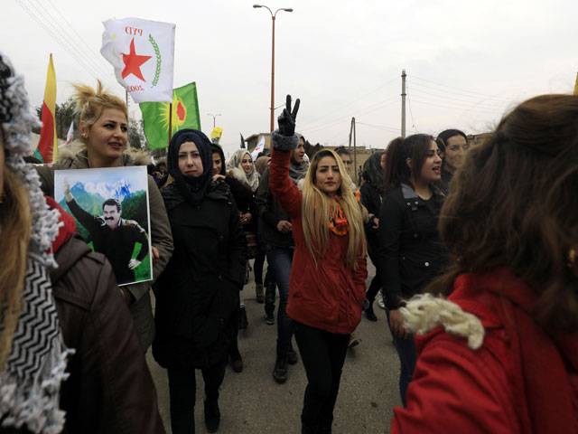 Syrian-Kurds carry portraits1