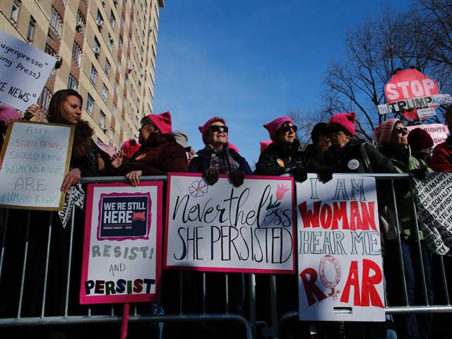 Women attend the National Women's March