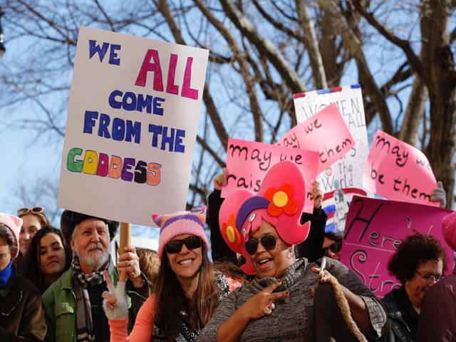 Women attend the National Women's March