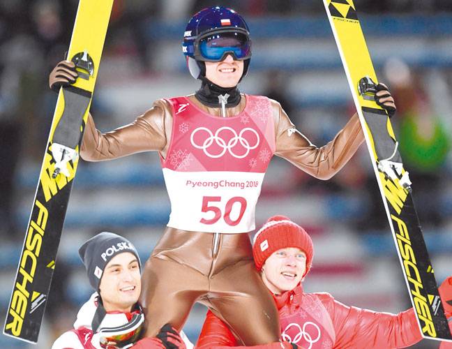 Stoch retains Olympic ski jump title with last leap