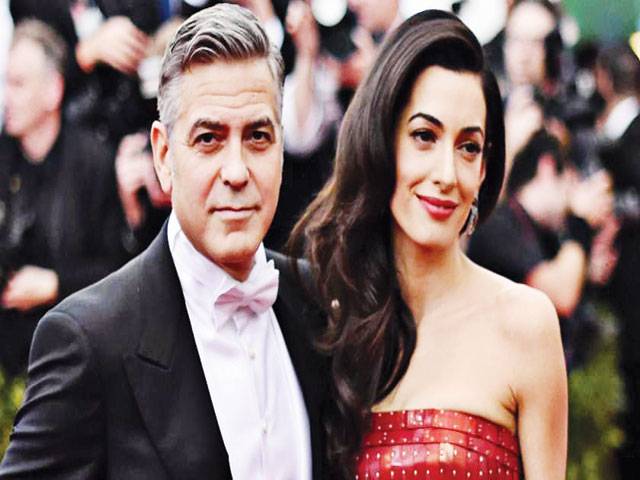 Clooney fascinated by wife Amal