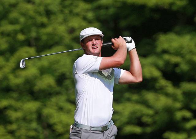 DeChambeau leads by one, Woods in the hunt at Memorial