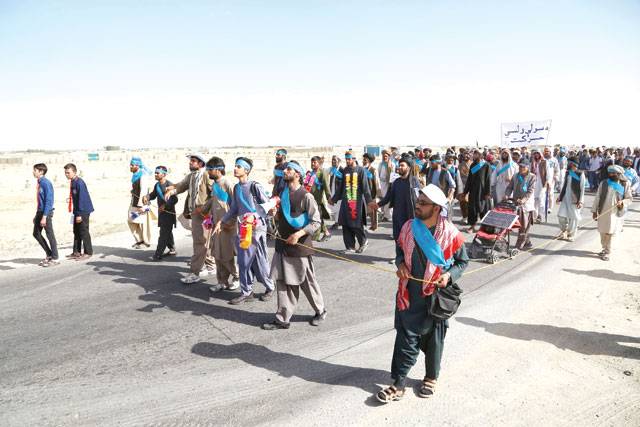 Blistered and hungry: Afghans march for peace