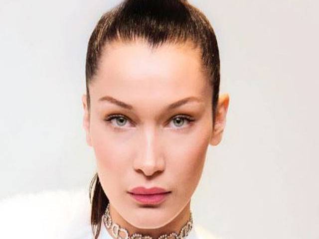 Bella Hadid has a brand name burnt onto her back