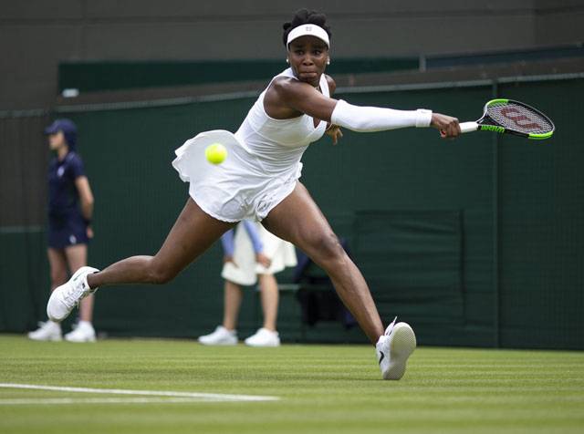 Flawless Federer gives Wimbledon masterclass, Venus hits back