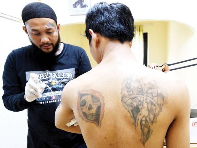 Indonesia’s tattoo removers zap sin from your skin