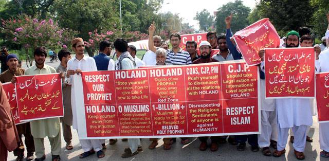 Faithful hold banners as they stage a protest in Islamabad