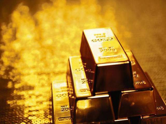 Gold hits 17-month low as investors seek refuge in dollar