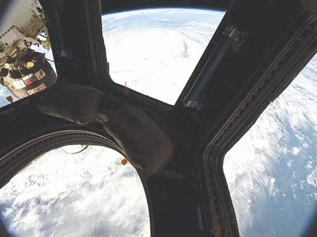 Cosmonaut shows space station hole to calm public