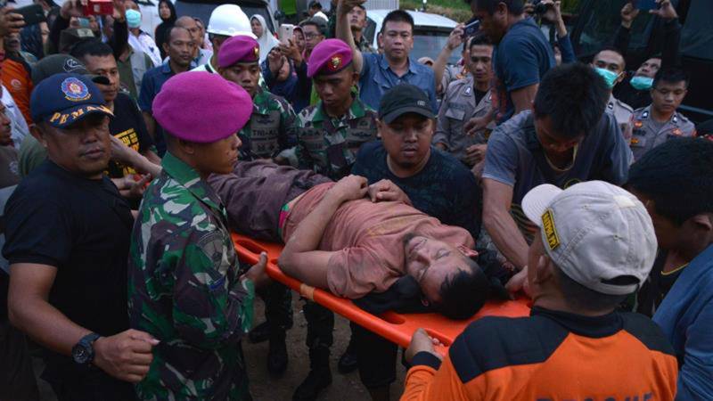 Dozens buried by landslide in Indonesia