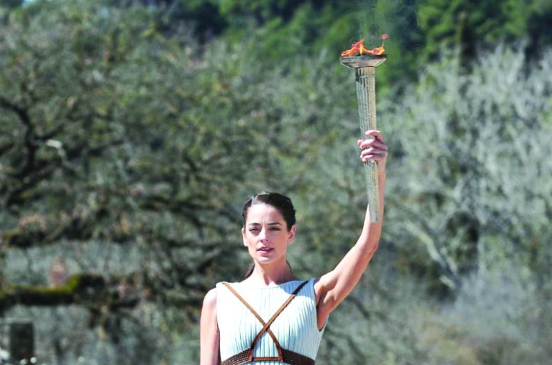 Olympics torch lit behind closed doors in ancient Olympia