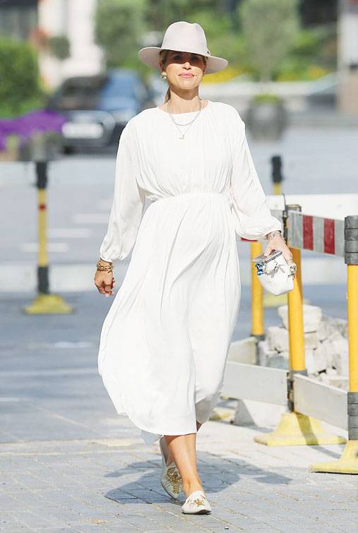 Step out in style like VOGUE in chic white dress