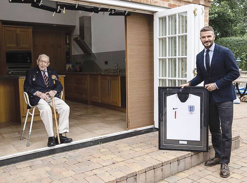 David Beckham presents Captain Sir Tom Moore a framed football shirt