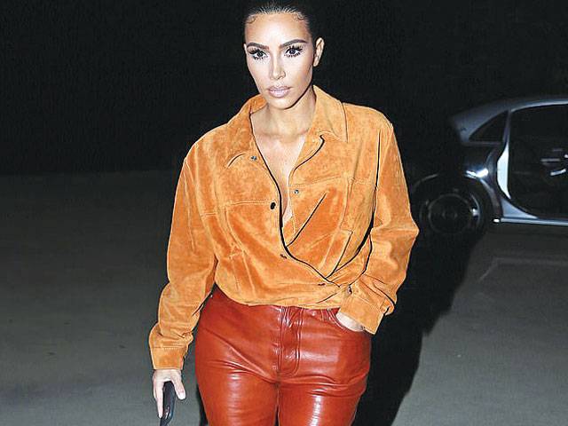 Kim Kardashian wears suede shirt as she visits a friend