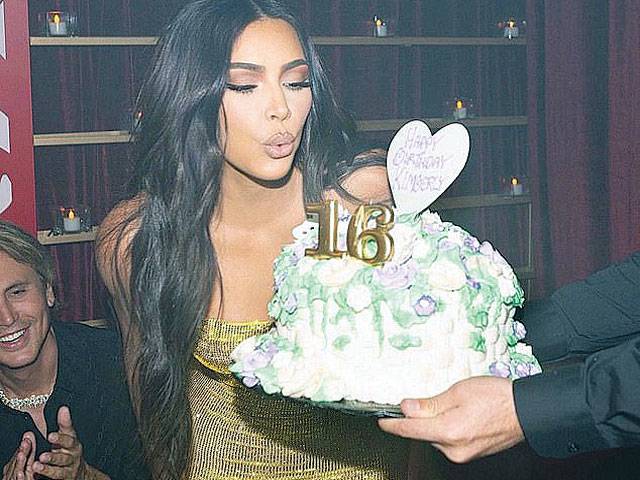 Kim Kardashian blows out candles at 40th birthday