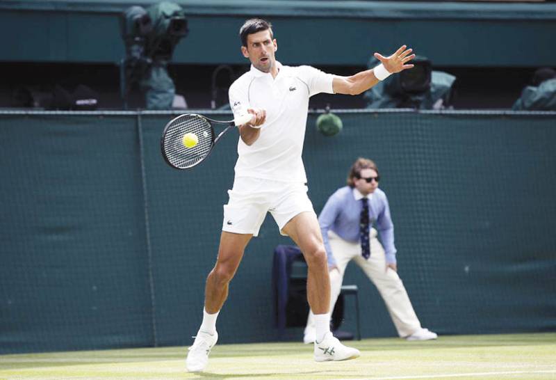 Djokovic rolls into Wimbledon quarterfinals