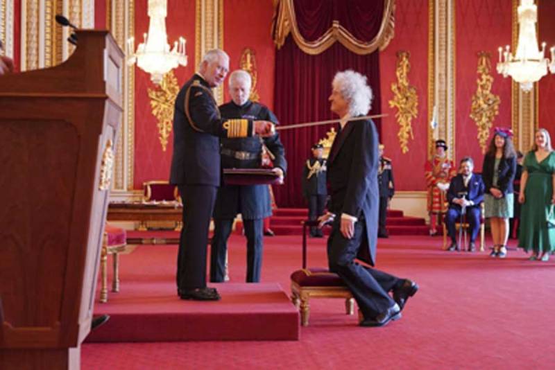 Brian May receives knighthood from King Charles III
