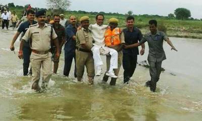 Twitter users mock Indian politician carried through floods