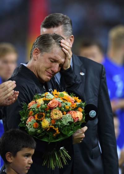 Tearful Schweinsteiger bows out in Germany's win