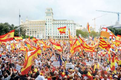 Catalans march for unity on Spain's national day