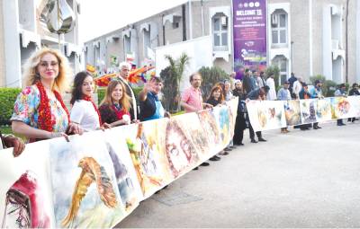 Artists make history by colouring 25-meter long painting