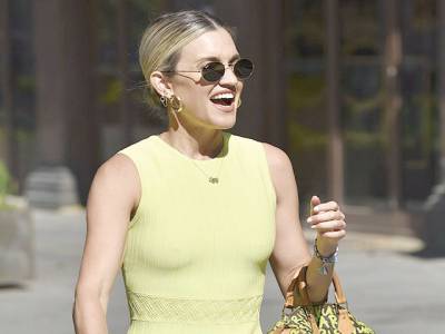 Ashley Roberts is radiant in a bright yellow sundress!