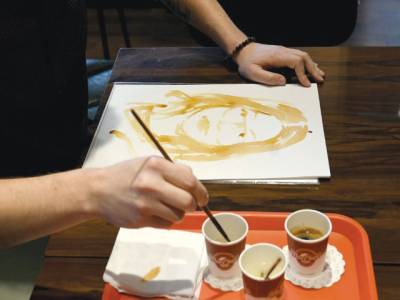 Albanian artist offers ‘therapy’ with portraits painted in coffee