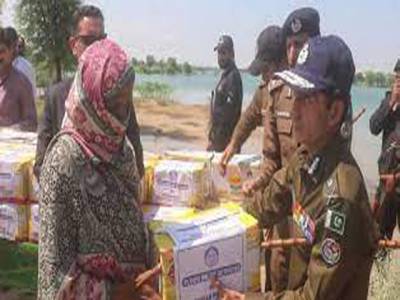 Police distribute ration bags among flood-affected families